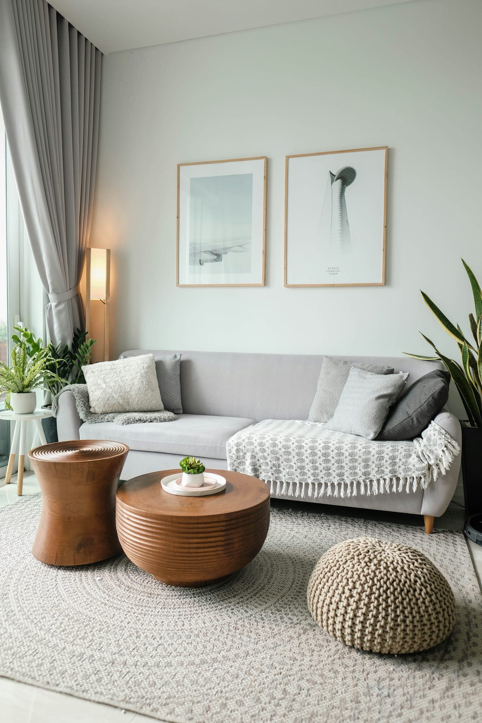 A tidy, daylit living room with a light sofa and coffee table.